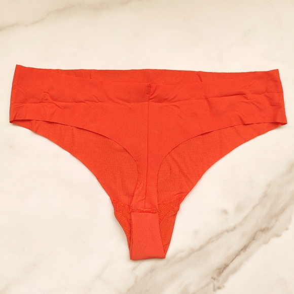 NWOT CALVIN KLEIN INVISIBLES THONG IN CHERRY TOMATO SIZE SMALL - Picture 2 of 4